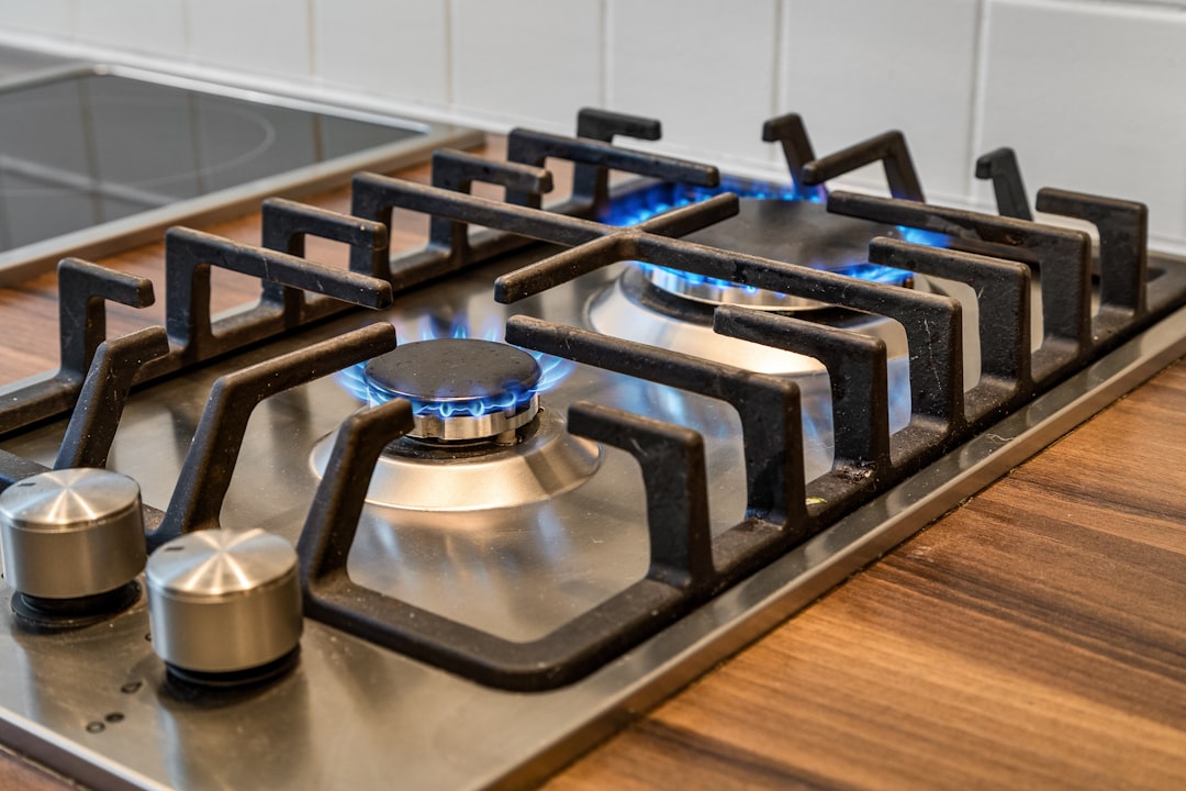 a-gas-stove-with-a-blue-flame-on-it-so1kvm-qrvo